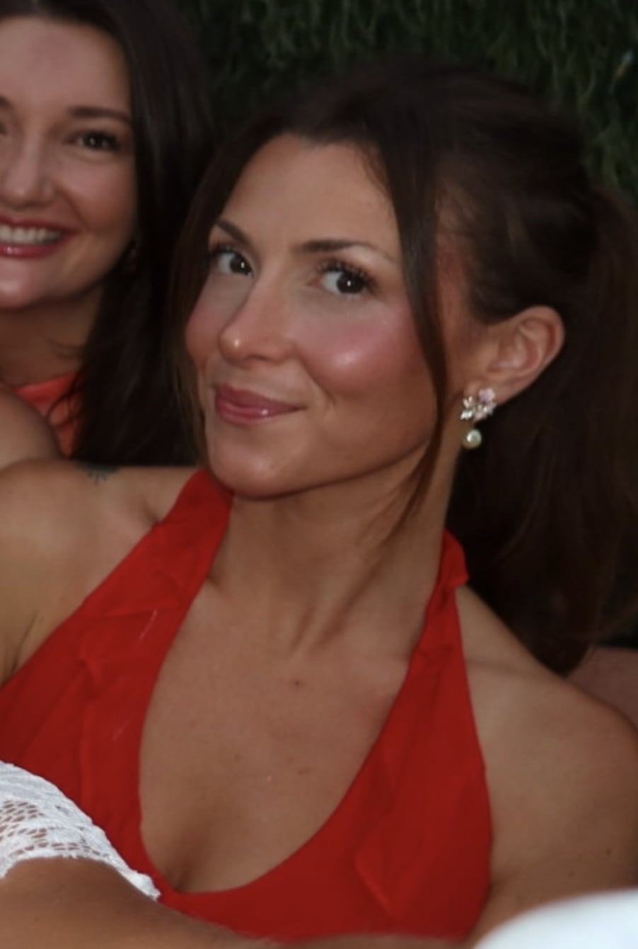 Steph Storie smiling in a red top